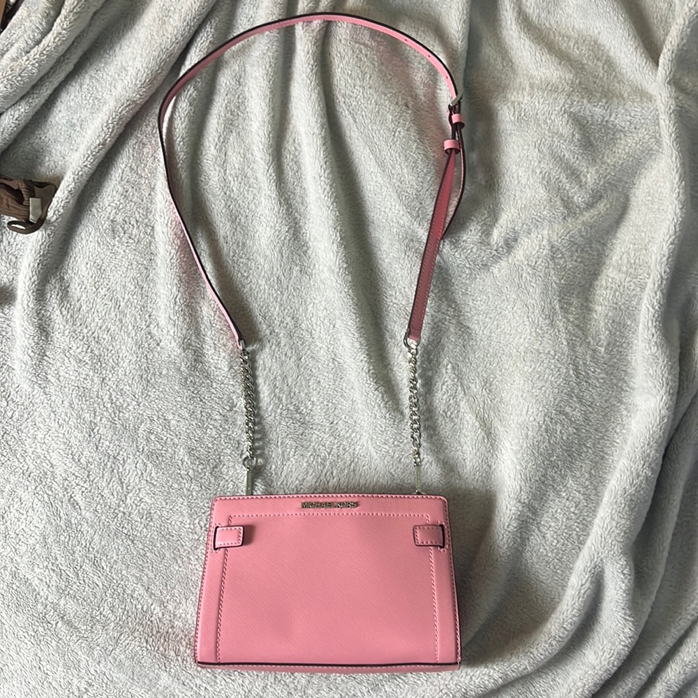 Cutest small Michael Kors Pink cross body purse in Pink!